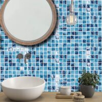 Luxury swimming pool with elegant blue glass mosaic tiles in Dubai